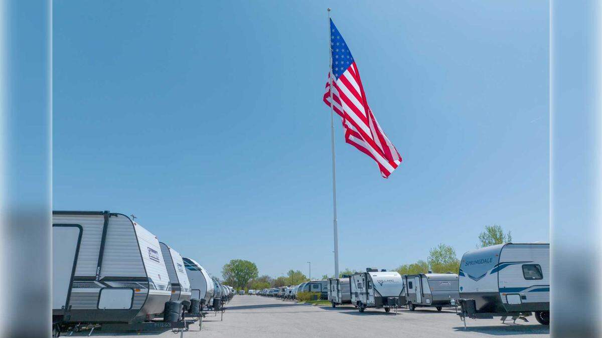 A giant American flag is seen flying above the Camping World RV dealership in Roseville during a Memorial Day weekend in 2024. The 3,200-square-foot flag was stolen on Tuesday, Jan. 20, 2026, after thieves cut it from its 130-foot pole and hauled it away in a pickup truck, according to dealership officials and police.