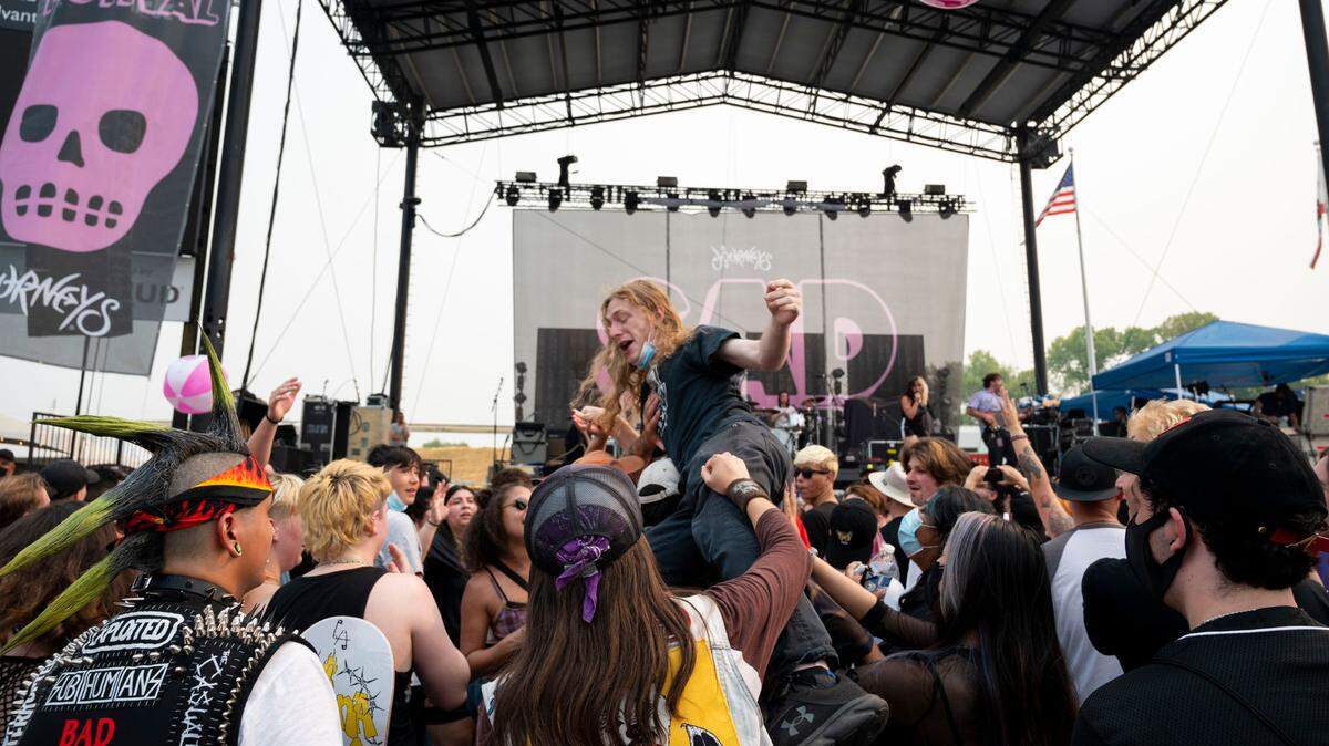 A concert goer surfs the crowd as the Sacramento punk band Destroy Boys performs at Sad Summer Fest, Friday, Aug. 6, 2021, at Heart Health Park in Cal Expo.