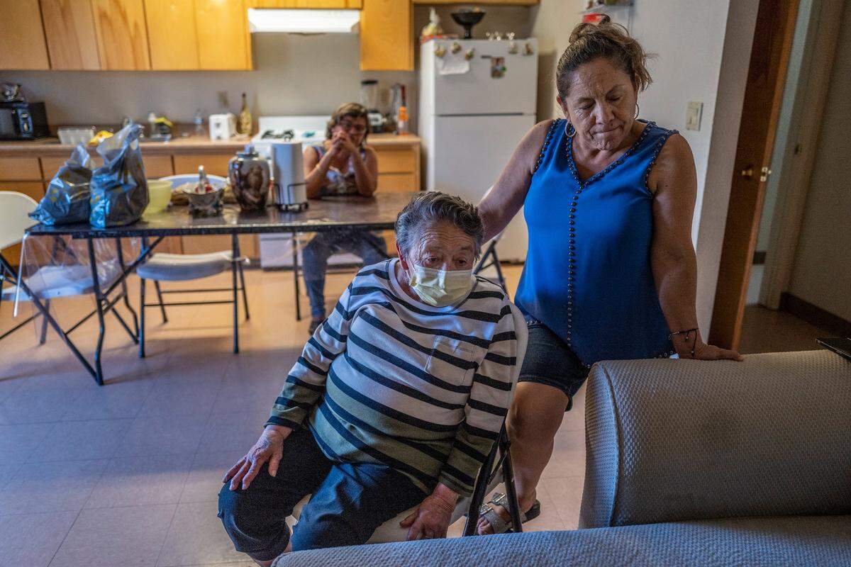 Farmworker Margarita Anaya de Chavez, 59, right, stands with her mother Maria de Lourdes Ortiz de Anaya, 82, who suffers from cancer, inside their apartment at Davis Migrant housing in Dixon in October. “It’s very difficult to find low-income housing quickly that I can pay for,” said Anaya de Chavez who says she needs to stay close to her mother’s doctors while she undergoes chemo treatments.