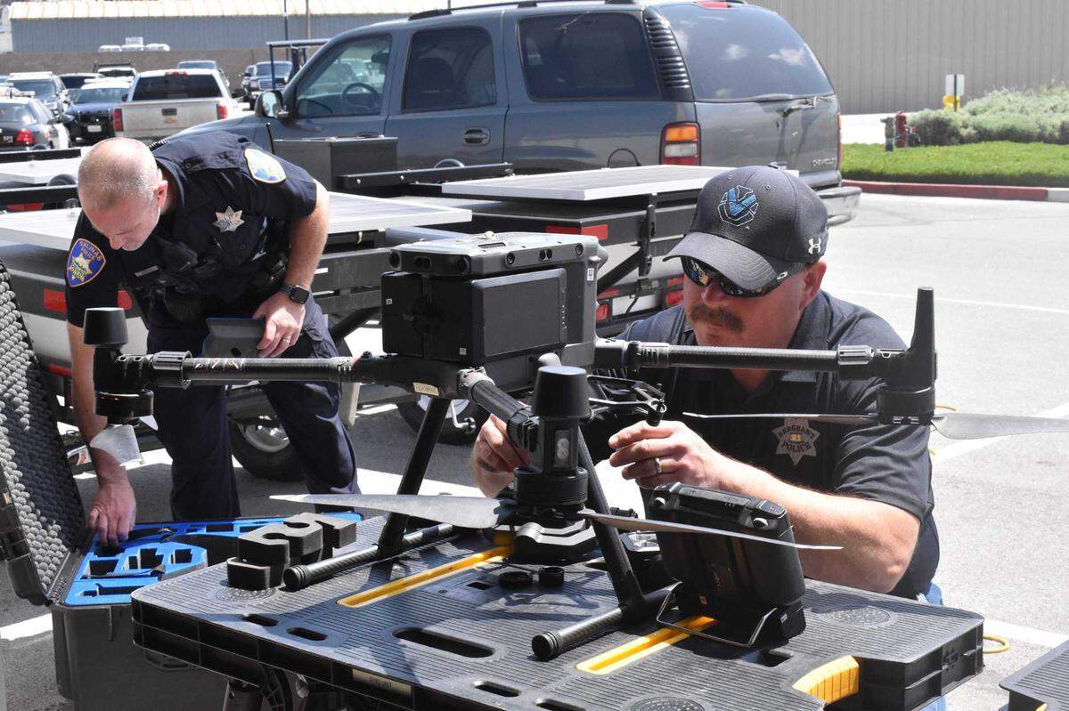 Salinas police officers assemble a DJI Matrice drone in 2022. Deputies in Sacramento County will receive three such models of unmanned aerial systems as part of its 2024-25 military equipment request to the Board of Supervisors.