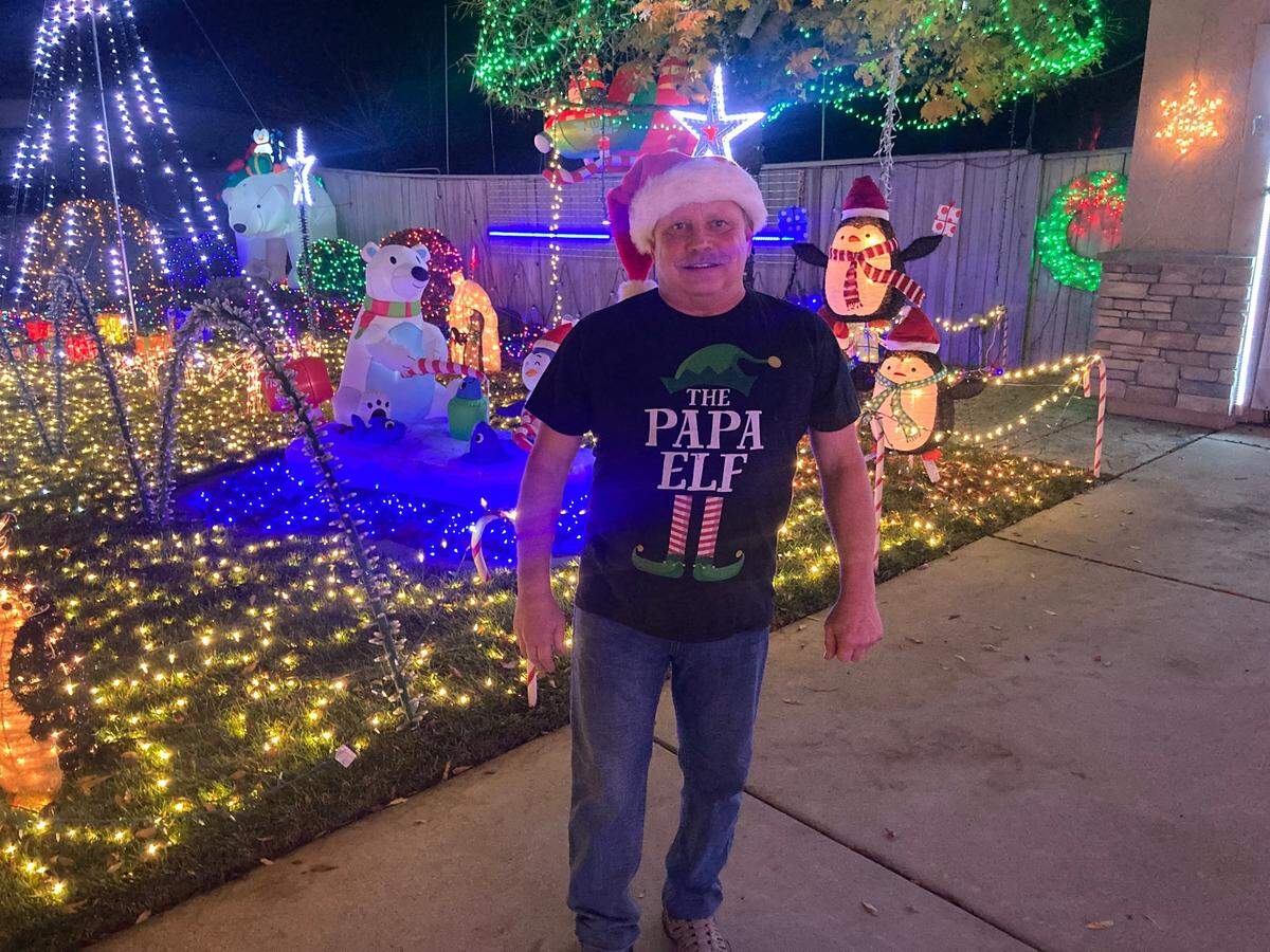 David Groza stands among his holiday decorations on Dec. 4, 2024, at his home on Mainstay Court in Elk Grove.