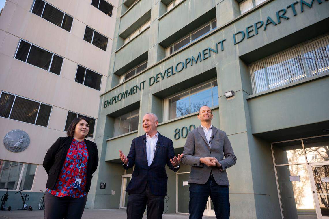 Sacramento City Councilwoman Katie Valenzuela, Mayor Darrell Steinberg and Assemblyman Kevin McCarty comment in front of the Employment Development Department building in Sacramento in 2023, after the announcement that it was one of three state office buildings being made available for downtown housing.