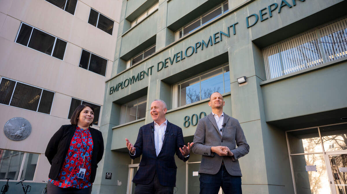 Sacramento City Councilwoman Katie Valenzuela, Mayor Darrell Steinberg and Assemblyman Kevin McCarty comment in front of the Employment Development Department building in Sacramento on Jan. 30, 2023, after the announcement that it was one of three state office buildings being made available for downtown housing.