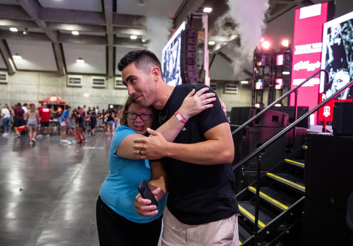 Cameron Iwasa, former Sacramento Republic FC player and leading goal scorer, is hugged by fan Rebecca Dixon, of Sacramento, after the U.S. Open Cup final game watch party at SAFE Credit Union Convention Center on Wednesday, Sept. 7, 2022, in Sacramento. Orlando City SC pulled ahead towards the end of the game, played in Exploria Stadium in Orlando, to beat Sacramento 3-0 for the title.