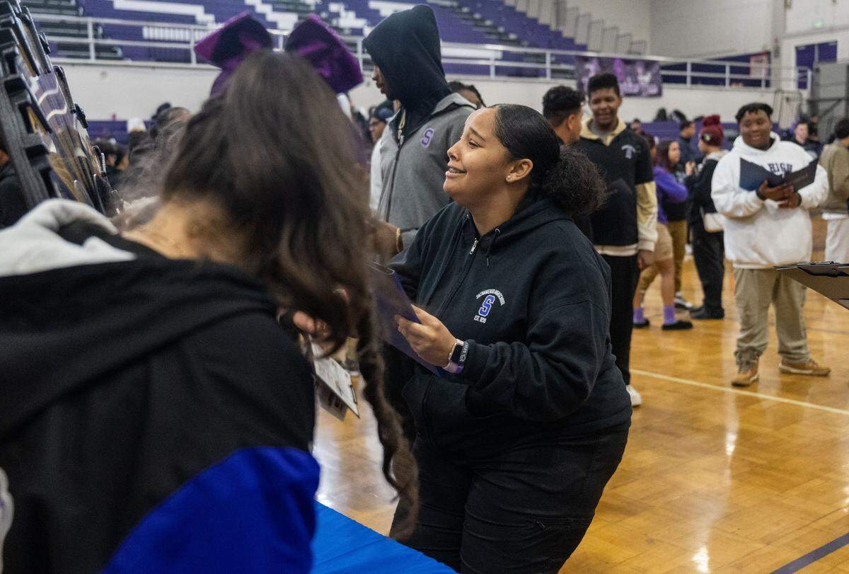 Angelica Coubb, a student at Sacramento Charter High School, reacts to “losing” a fictional $200 on a spinning wheel during a financial literacy workshop held at the school by Golden 1 Credit Union on Wednesday.