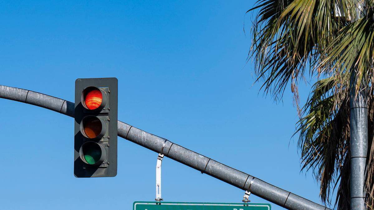 A red light at the intersection of Broadway and Land Park Drive in Sacramento on Wednesday, April 19, 2023. 