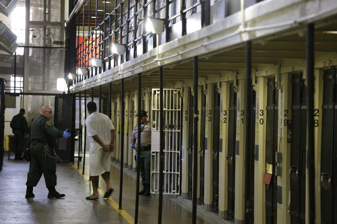 A condemned inmate is led out of his east block cell on death row at San Quentin State Prison in August 2016.