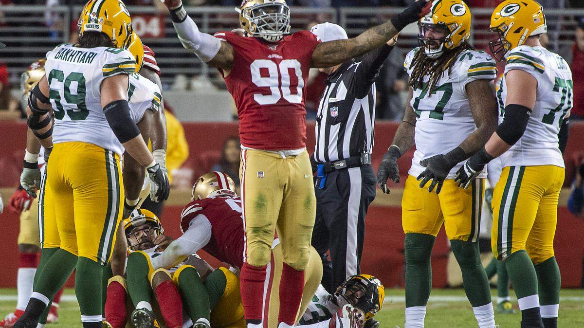 San Francisco 49ers’ Damontre Moore (90) react after Green Bay Packers starting quarterback Aaron Rodgers (12) is sacked in the second half during a game at Levi’s Stadium on Sunday, November 24, 2019 in Santa Clara.