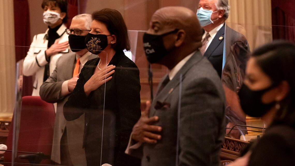 California Senate President Pro Tem Toni Atkins, center, recites the Pledge of Allegiance with colleagues, from left, Nancy Skinner, D-Berkeley, Anthony J. Portantino, D-La Canada Flintridge, Steven Bradford, D-Gardena, and Lena A. Gonzalez, D-Long Beach, during the opening of the legislative session at the state Capitol on Monday, Dec. 7, 2020 in Sacramento.
