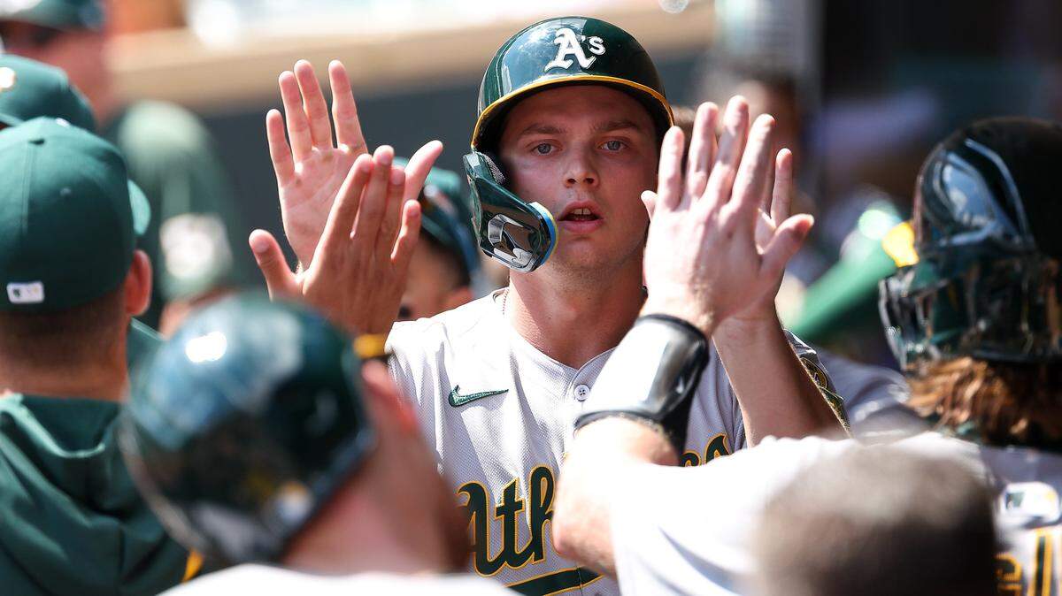 Aug 21, 2025; Minneapolis, Minnesota, USA; Athletics first baseman Nick Kurtz (16) celebrates after scoring on a double hit by center fielder Lawrence Butler (4) during the second inning against the Minnesota Twins at Target Field. Mandatory Credit: Matt Krohn-Imagn Images