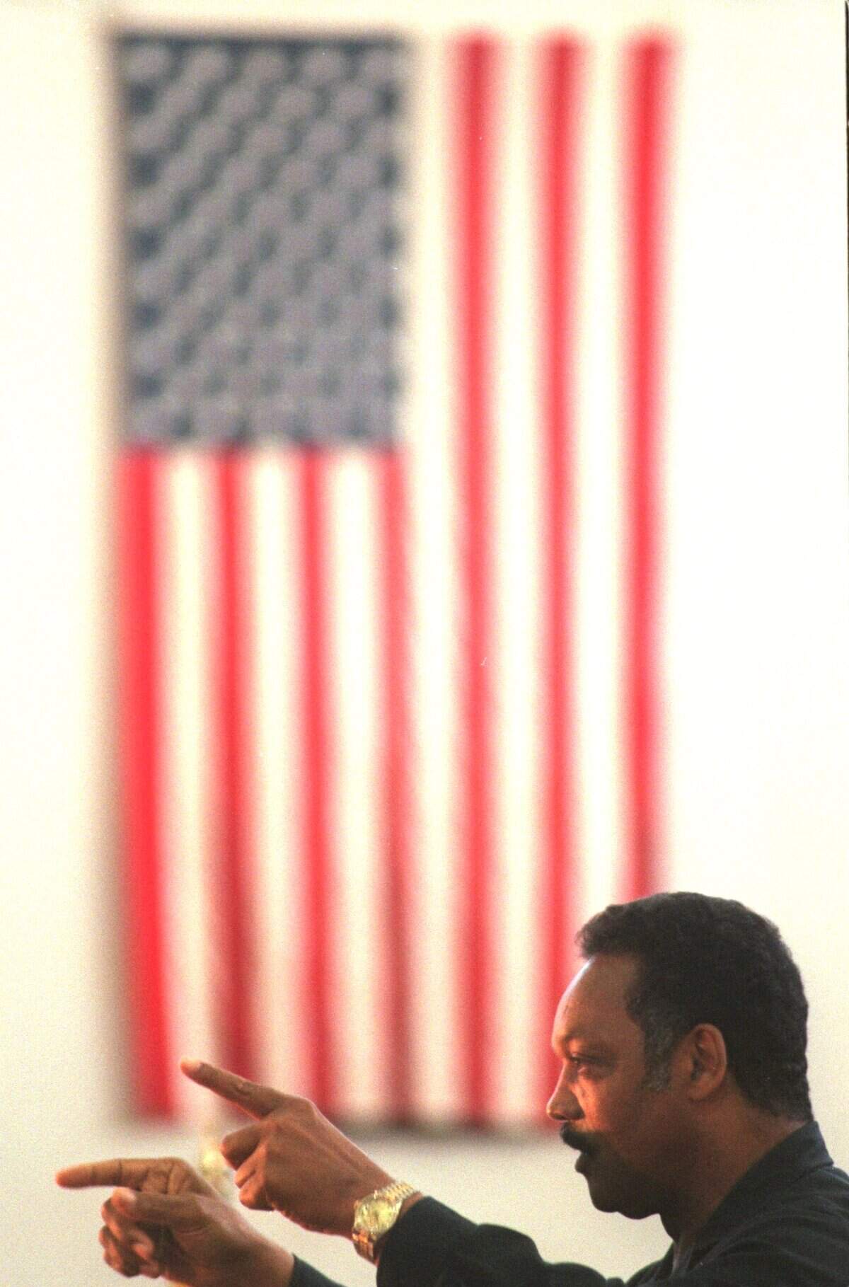 Rev. Jesse Jackson, points to the students at Sacramento High School during a speech on Sept. 17, 1997, about the need to set goals. Jackson used anecdotes to deliver the importance of staying in school.