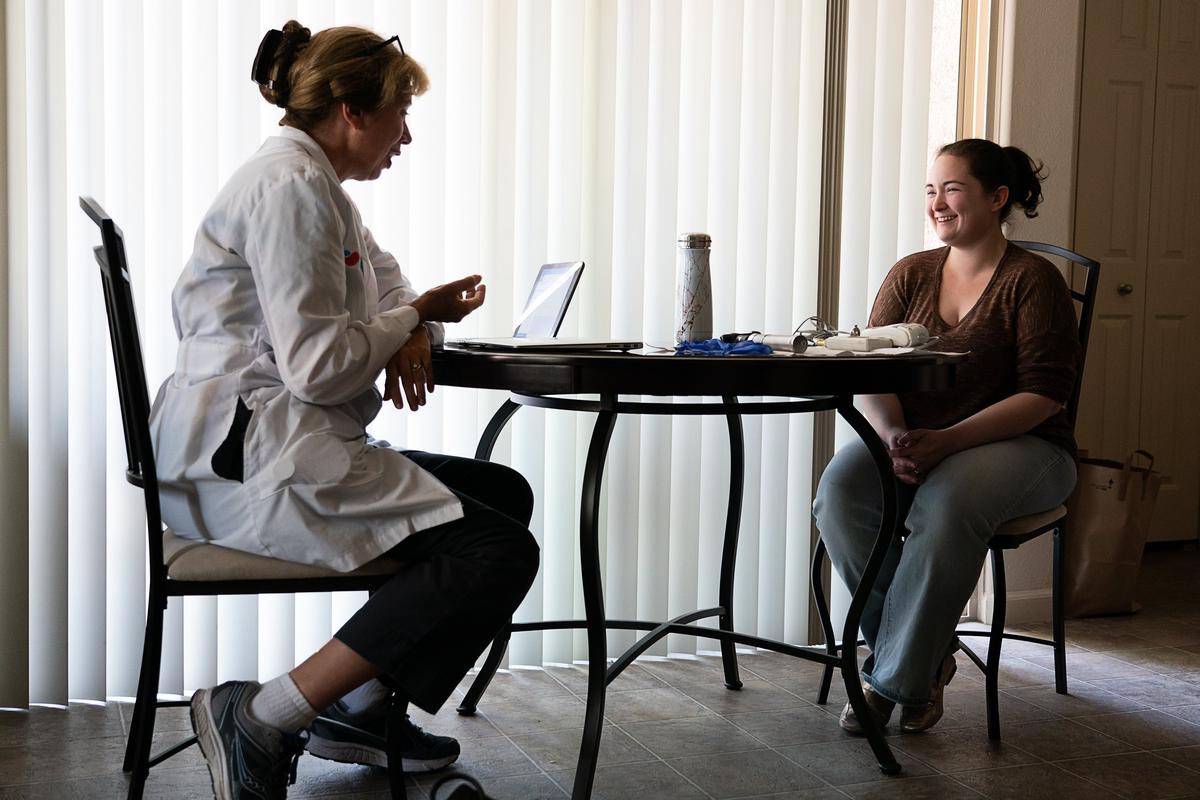 Dr. Janet O’Brien talks with her patient, Sarah Gonzalez, during her medical appointment at her home on Monday in Roseville.