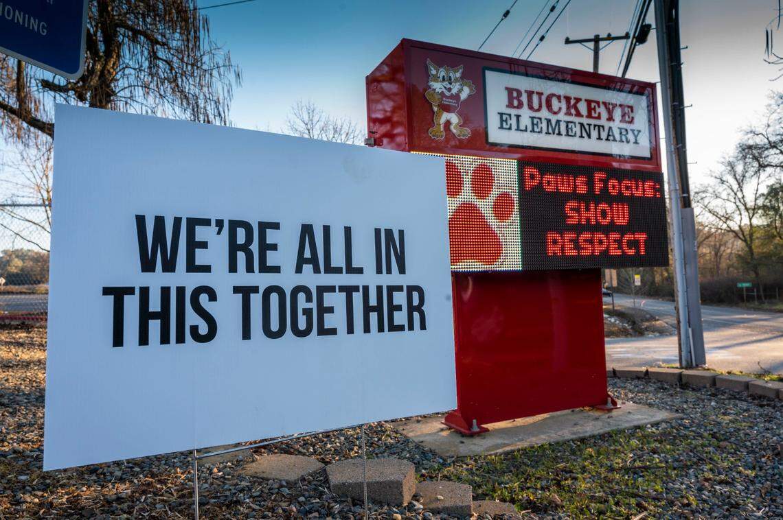 A sign next to the Buckeye Elementary School marquee in Shingle Springs sends a message during the COVID-19 pandemic on Monday, Jan. 24, 2022.
