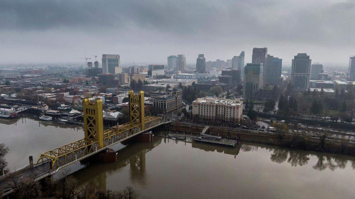 A view of the Sacramento skyline from above shows the Tower Bridge and water levels on the Sacramento River after overnight showers fell in the Sacramento region on Wednesday. The primary motor is broken on the bridge but Caltrans officials say its structurally safe for vehicles to cross .
