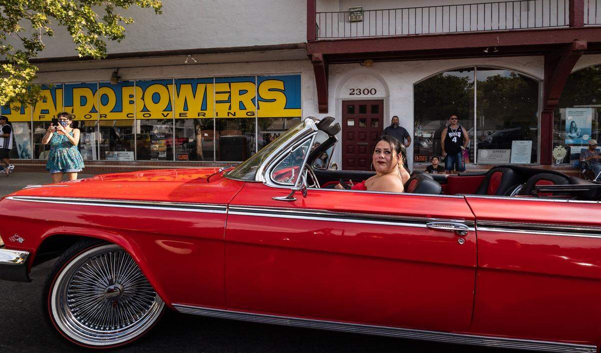 Lowriders and classic cars line Broadway in Sacramento during a Saturday afternoon cruise on July 31, 2021.