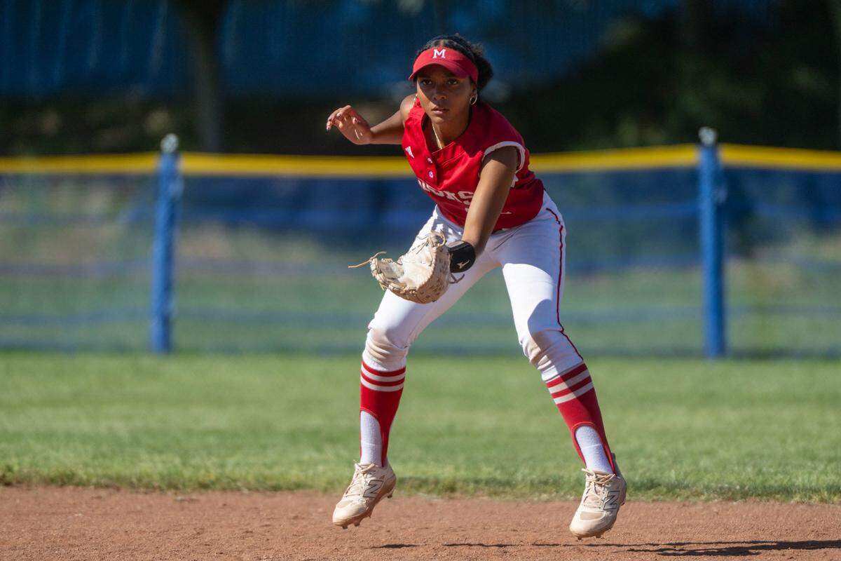 McClatchy Lions Jayeliza Rogers jumps between pitches against the Folsom Bulldogs during a first-round Sac-Joaquin Section Division I softball playoff game at Folsom High School on Wednesday.
