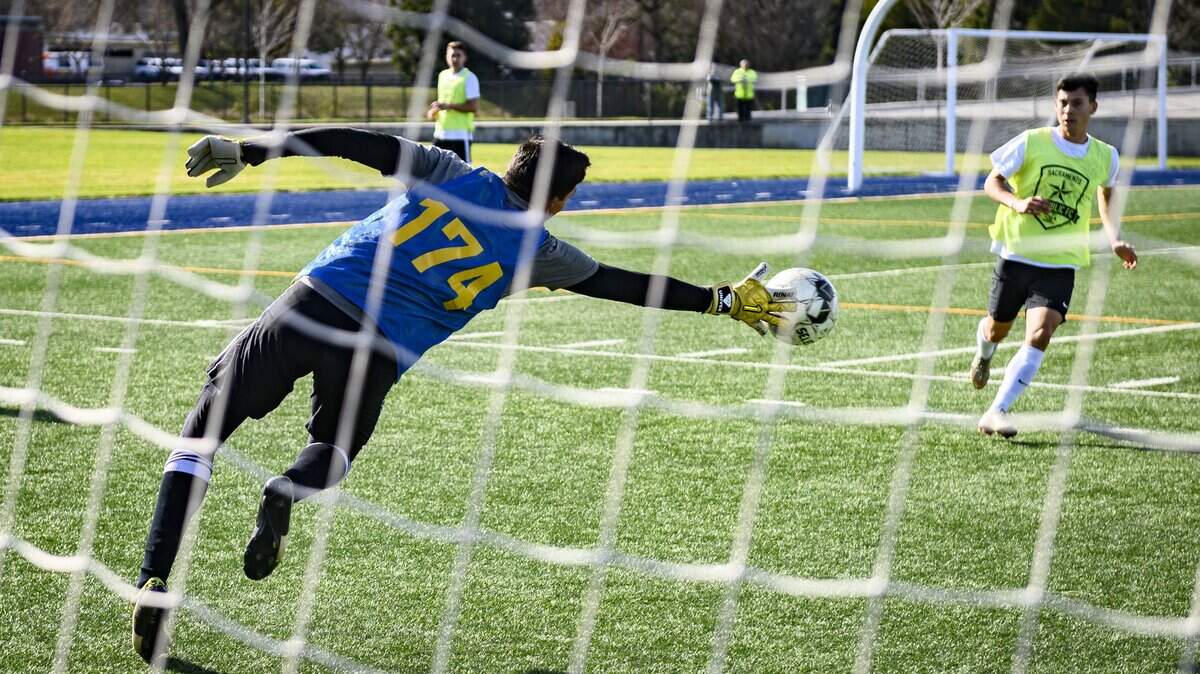 Goalie Francisco Garcia blocks a goal attempt, Saturday, Jan. 18, 2020, as he and dozens of other soccer players take a shot a professional contract during open tryouts for the Sacramento Republic FC at Cosumnes River College.