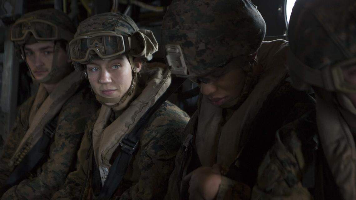 Marine Corps Sgt. Nicole Gee, second from left, a maintenance technician with 24th Marine Expeditionary Unit, awaits the launch April 5, 2021, during a care exercise aboard the USS Iwo Jima. The Department of Defense announced Saturday that Gee was one of 13 American service members killed in an attack Aug. 26 at Hamid Karzai International Airport in Kabul, Afghanistan.