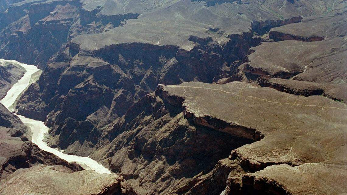 A Grand Canyon boater died after the boat flipped in rapids on the Colorado River, park rangers said.