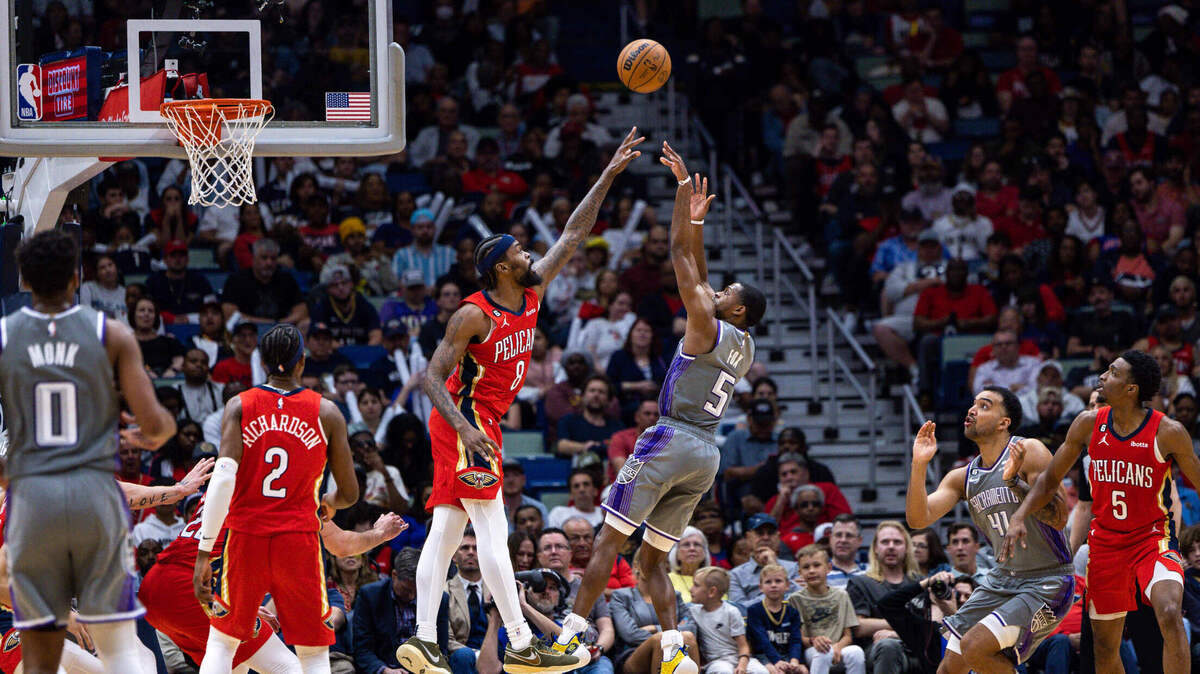 Sacramento Kings guard De’Aaron Fox (5) shoots a jump shot over New Orleans Pelicans forward Naji Marshall (8) during the second half at Smoothie King Center on April 4, 2023.