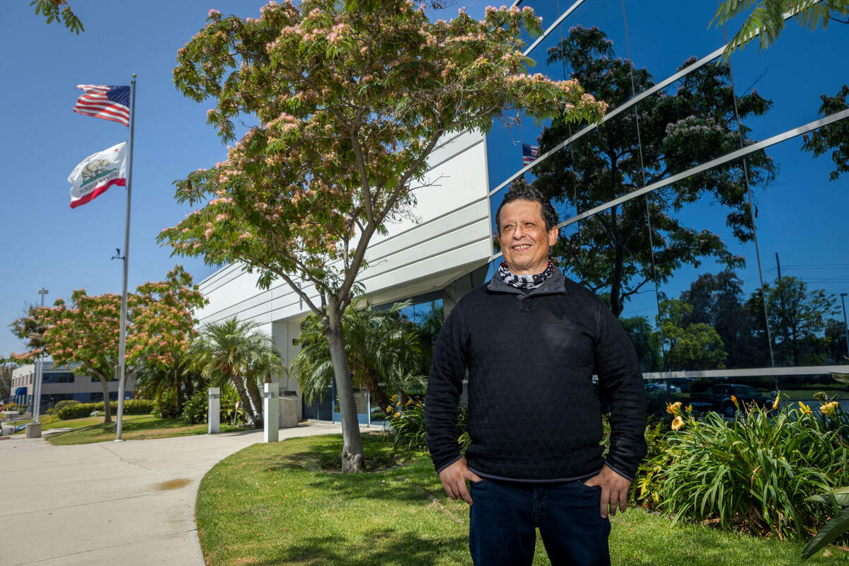 Employment Development Department front-line employee Ben De La Torre stands outside their offices in Chula Vista on June 30. The 14-year department veteran earned $120,000 in overtime pay in 2021, nearly double his $62,000 salary, to help with the flood of unemployment insurance claims during the pandemic.