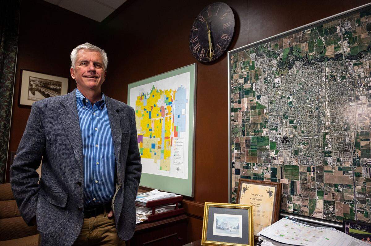 Lodi City Manager Steve Schwabauer stans in his Lodi City Hall office in February. The city is among those paying extra to CalPERS toward its long-term debts, which saves money over time, and has put aside about $20 million in a pension-dedicated fund run by a private company called Public Agency Retirement Service, Schwabauer said.