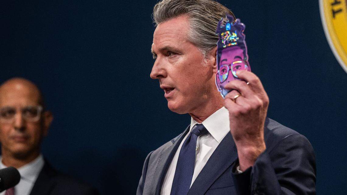 Gov. Gavin Newsom holds a pack of Tre House ItsPurpl THC-A gummies that he said are marketed to children during a press conference in Sacramento on Friday, Sept. 6, 2024.