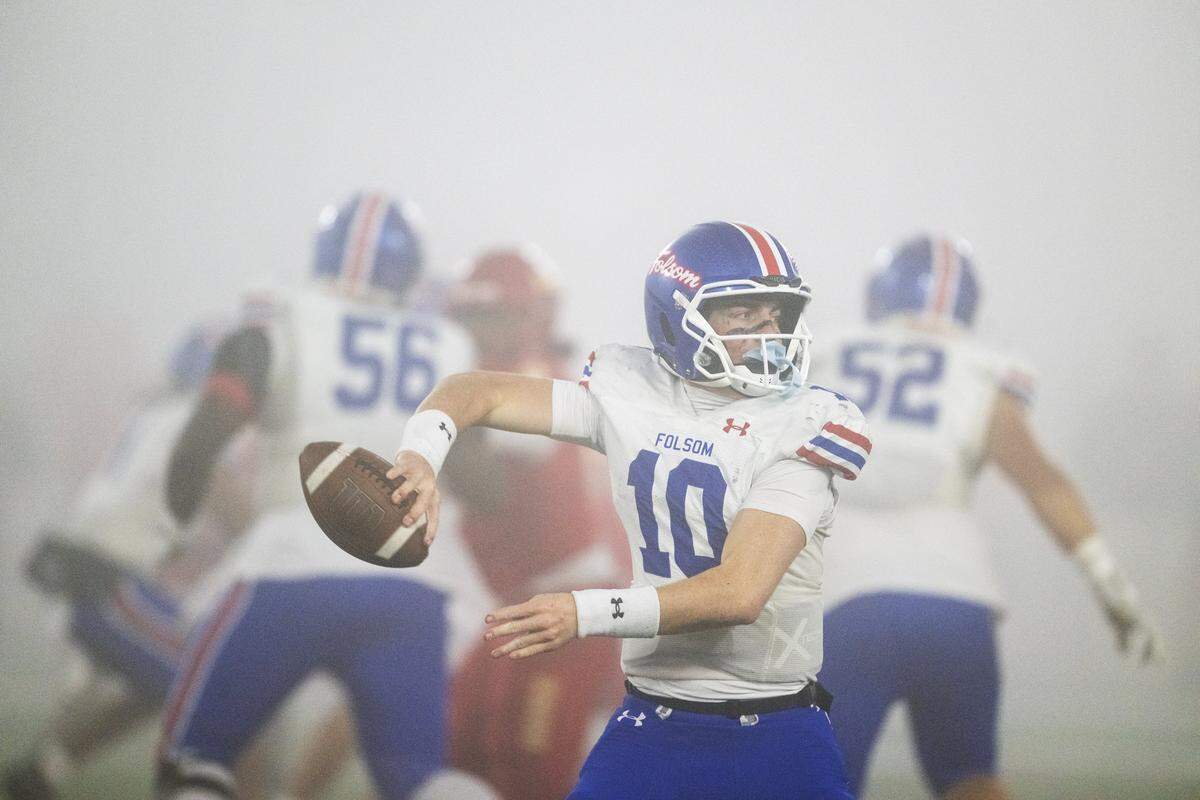 The Folsom Bulldogs' Brody Rudnicki (10) throws a pass in the first half of the CIF Division 1–AA State Championship football game against the Cathedral Catholic Dons at Saddleback College in Mission Viejo on Friday.