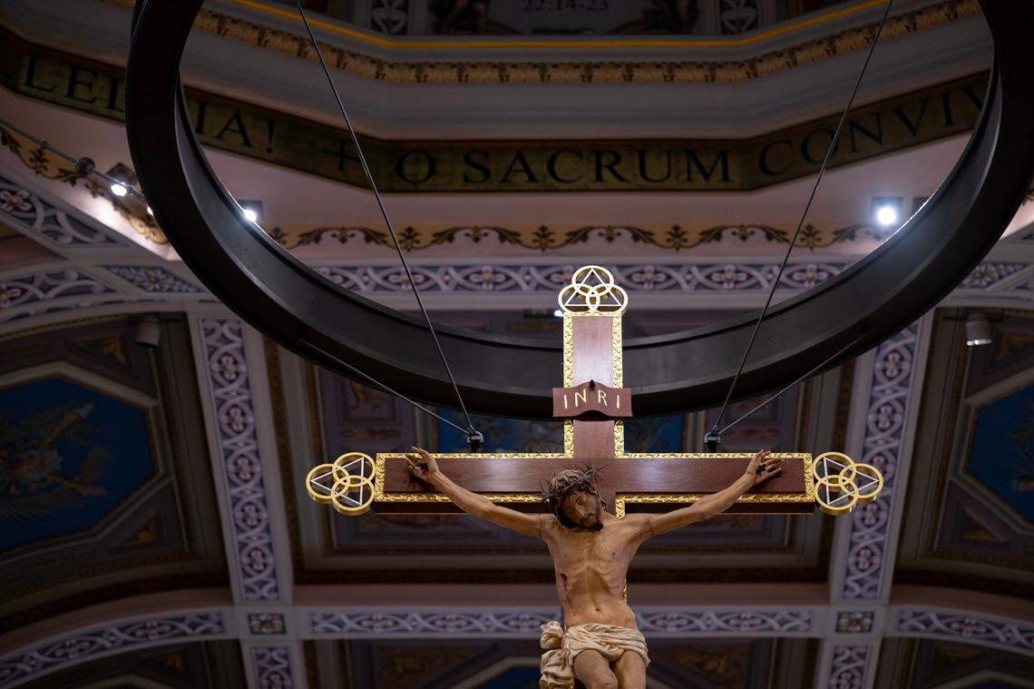 The crucifix hangs above the altar at the Cathedral of the Blessed Sacrament is suspended with aircraft cables.