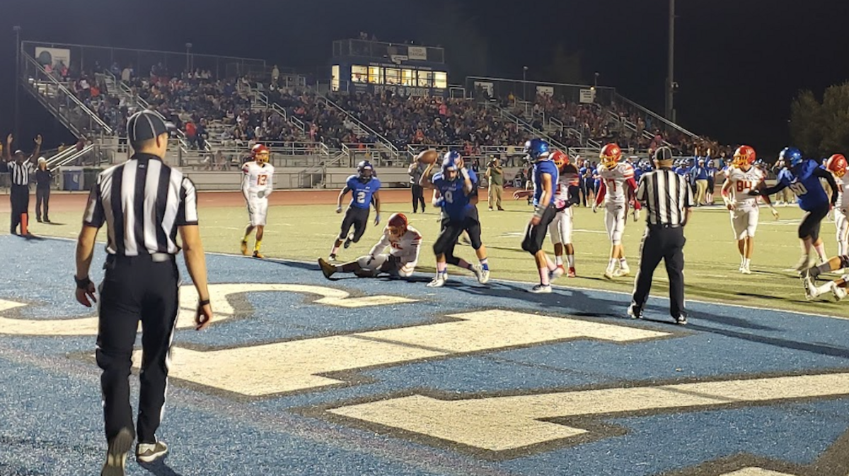 Davis’ Payne Barksdale celebrates after scoring on a 4-yard run during the Blue Devils’ 24-20 win over Jesuit on Friday.