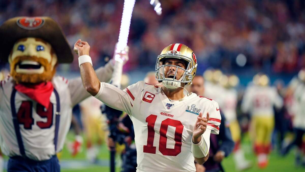 San Francisco quarterback Jimmy Garoppolo runs onto the field before the Super Bowl.