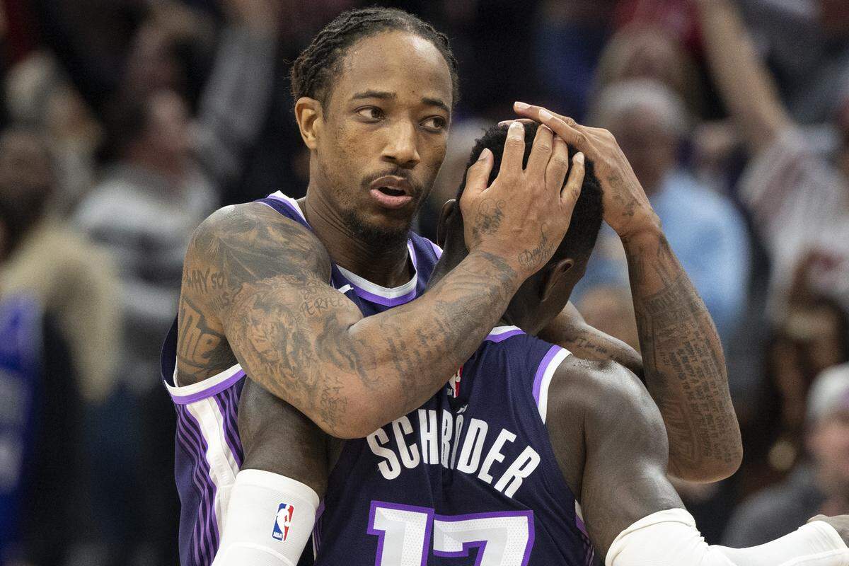 Sacramento Kings guard DeMar DeRozan embraces guard Dennis Schroder (17) after Schroder hit the game winning 3-point shot in overtime to defeat the Houston Rockets at Golden 1 Center on Sunday.