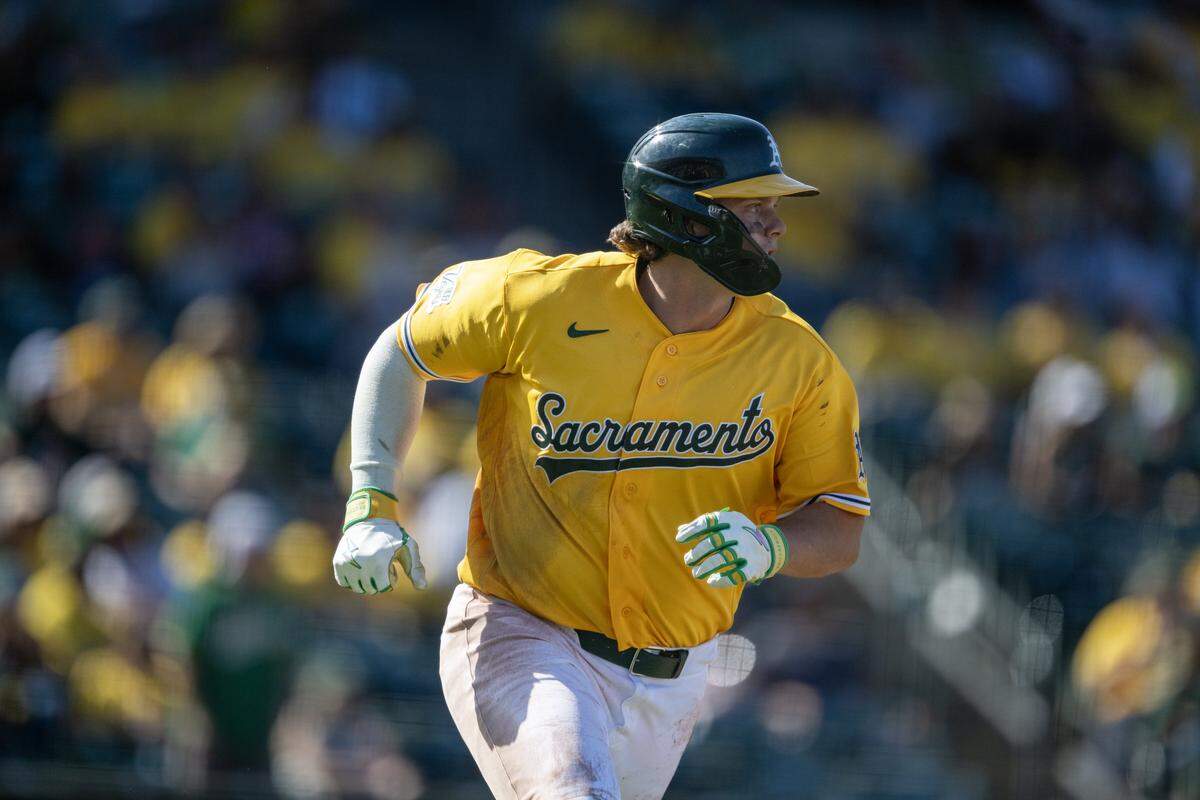 Athletics first baseman Nick Kurtz hits a single in the eighth inning of a game Saturday, April 4, against the Houston Astros at Sutter Health Park in West Sacramento. The team debuted its gold “Sacramento” alternate jerseys, also giving them away to fans in attendance.