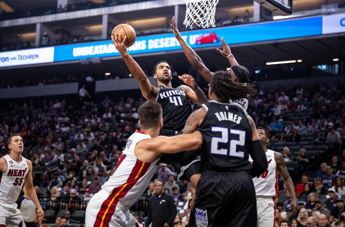 Sacramento Kings forward Trey Lyles (41) goes up for a shot against the Miami Heat during first quarter of the NBA basketball game Saturday, Oct. 29, 2022, at Golden 1 Center in Sacramento. He missed the shot but followed up with a rebound to score.