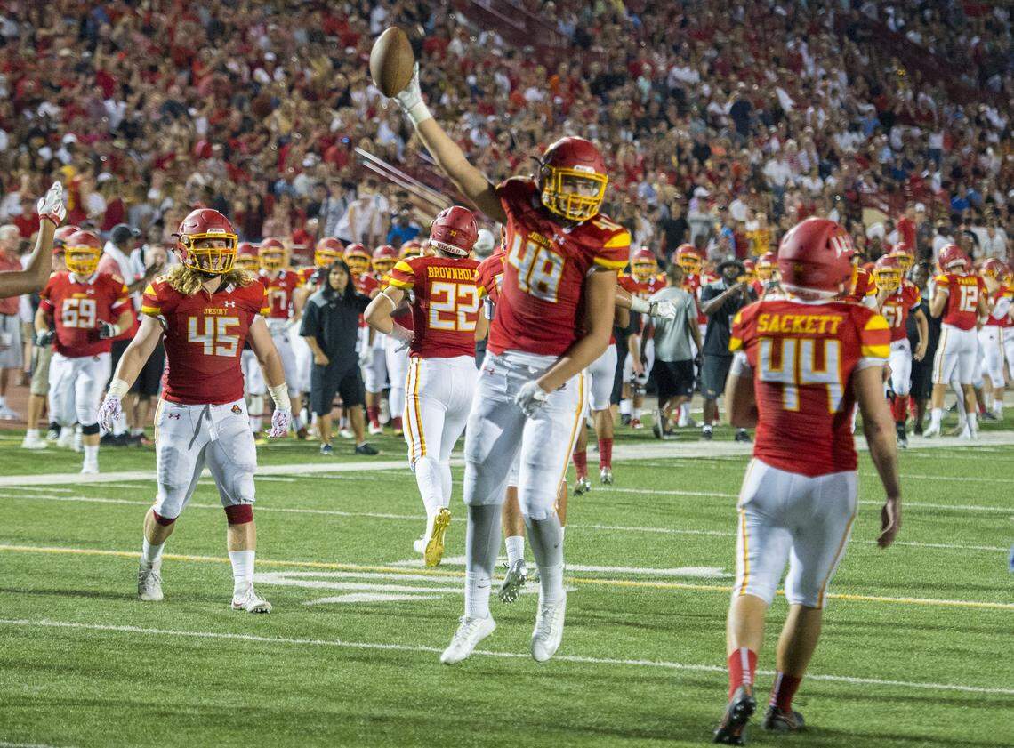 Jesuit’s Laiatu Latu celebrates a fumble recovery that stopped Christian Brothers at the goal line in the Holy Bowl at Hughes Stadium at Sacramento City College on Sept. 9, 2017.