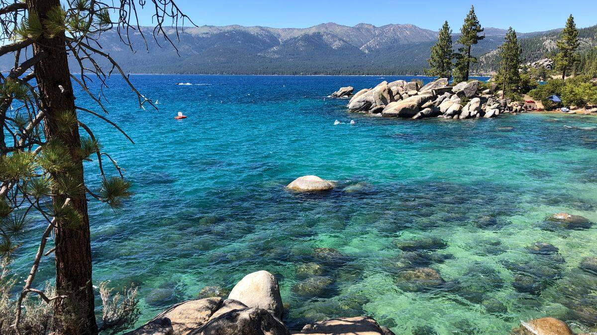 This photo taken July 13, 2020 at Lake Tahoe Nevada State Park shows a stretch of the lake’s northeast shore looking north from Sand Harbor toward Incline Village, Nev.
