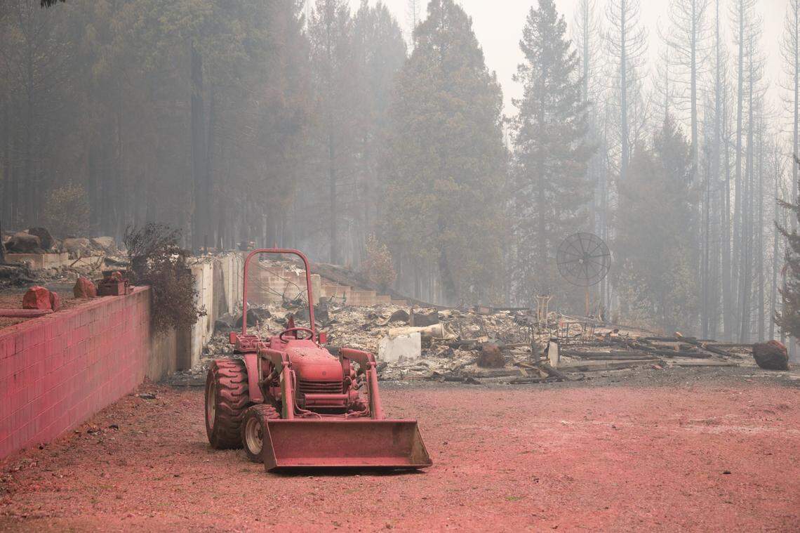 Fire retardant paints the ground Friday, Sept. 9, 2022, near home in Volcanoville that burned to the ground during the Mosquito Fire.