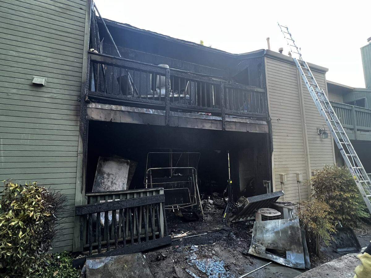 The charred remains of an apartment that burned on June 24, 2022 after a man held his 1-year-old hostage and set the building on fire.