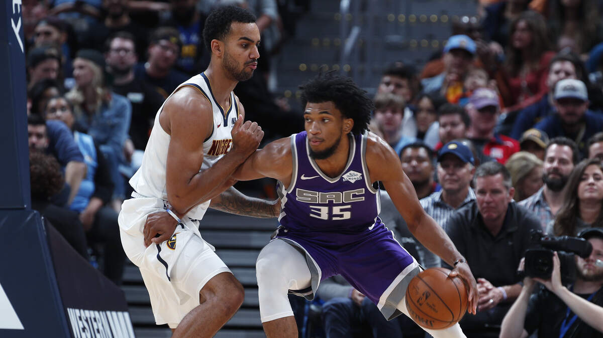 Kings forward Marvin Bagley III, right, works against Denver Nuggets forward Trey Lyles on Tuesday at Pepsi Center. Bagley scored 20 points in the Kings’ 126-112 loss.
