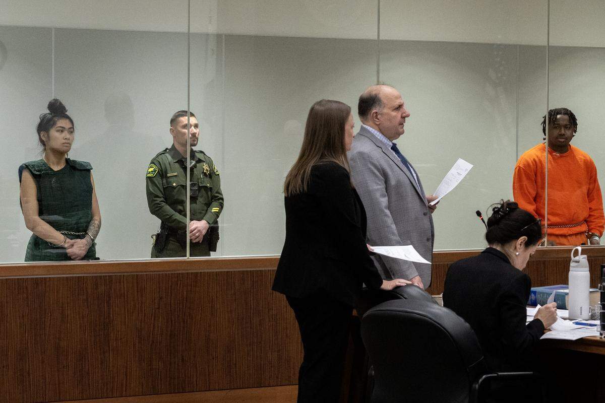 Assistant public defender Nick Tziavaras speaks to the judge during the arraignment of Jessica Savangsy and Retuquel Dupree in the Placer County Superior Court in Roseville on Wednesday. The couple was charged with murder and torture for the death of Savangsy's 7-year-old child.