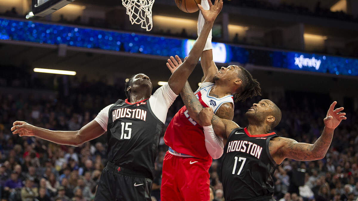 Sacramento Kings forward Richaun Holmes (22) battles Houston Rockets center Clint Capela (15) and Houston Rockets forward PJ Tucker (17) for rebound during a game at Golden 1 Center on Monday, Dec 23, 2019 in {city.}