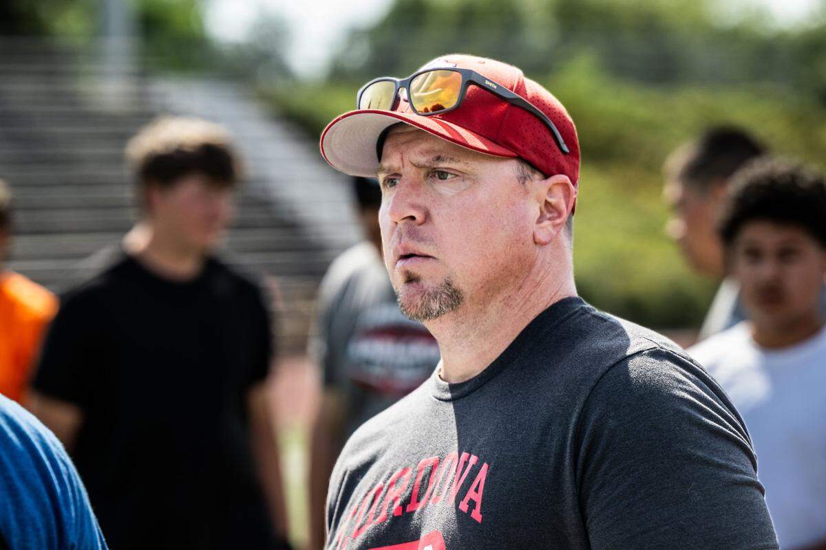 JP Dolliver, head coach for the Cordova High School football team, watches a play during spring training on Monday, May 20, 2024.