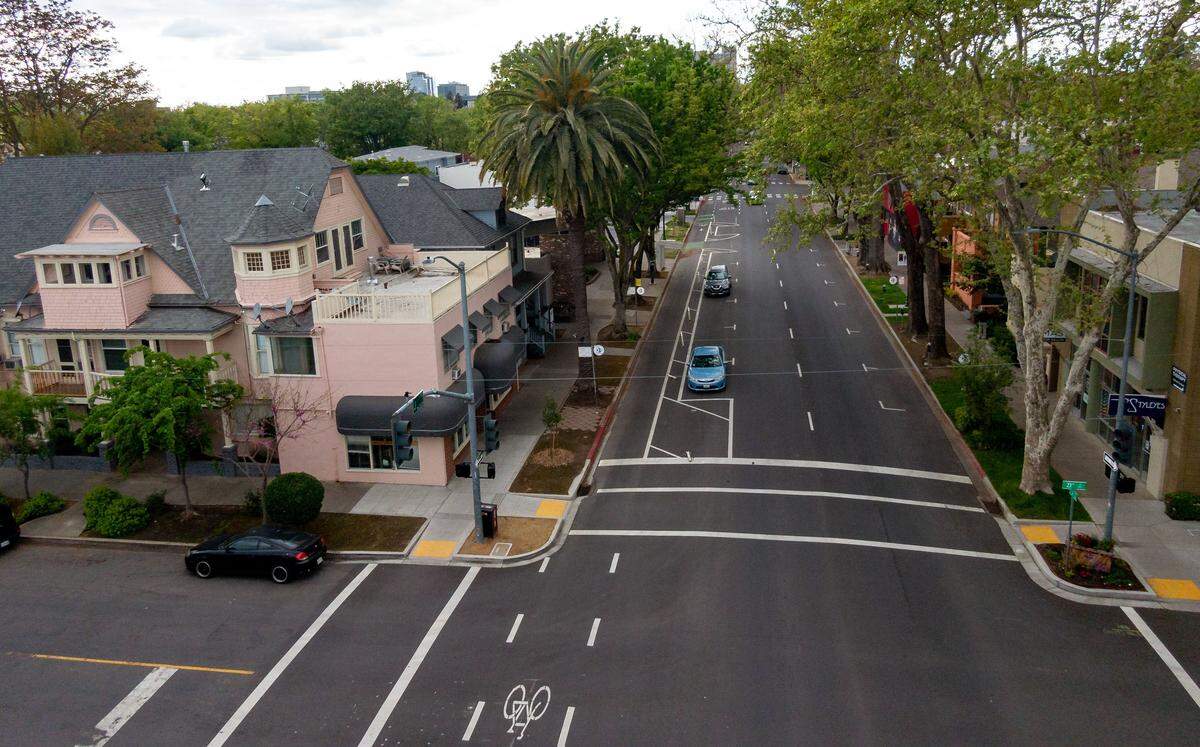 What normally would be a busy thoroughfare through the heart of the city, J Street appears almost empty, April 9, 2020, as many midtown businesses on the 2200 and 2300 block of J Street have closed after Sacramento County and the state passed stay-at-home ordinances to help slow the spread of the potentially fatal new coronavirus.