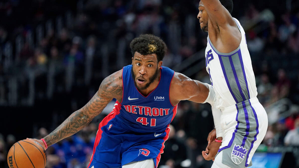 Detroit Pistons forward Saddiq Bey drives as Sacramento Kings guard De’Aaron Fox defends during the second half of an NBA basketball game, Monday, Nov. 15, 2021, in Detroit. (AP Photo/Carlos Osorio)