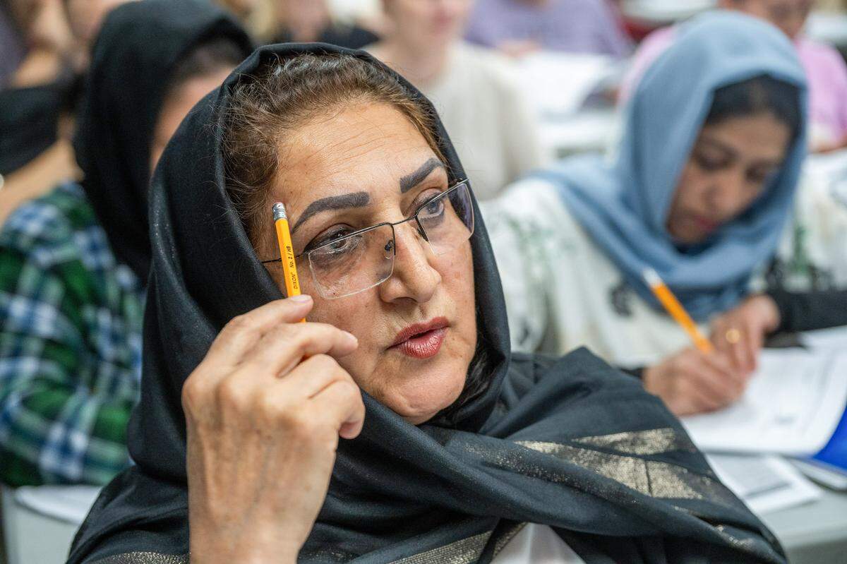 Laila Ahrary, 62, an Afghan refugee, works on her pronunciation during a Level 2 English class, where she is learning English as a second language, at Highlands Community Charter’s Grand Avenue campus last month.