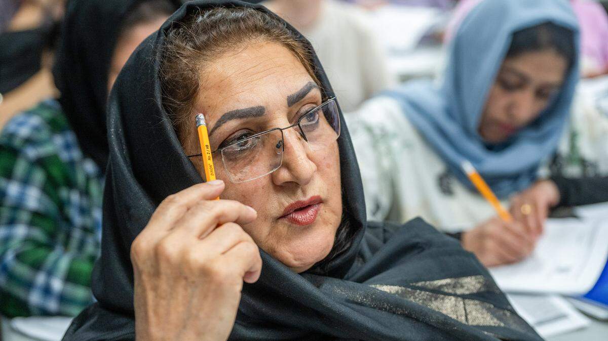 Laila Ahrary, 62, an Afghan refugee, works on her pronunciation during a Level 2 English class, where she is learning English as a second language, at Highlands Community Charter and Technical School’s Grand Avenue campus in Sacramento on May 20, 2025.