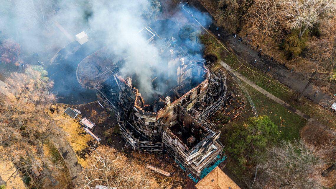 Smoke rises from the burned out interior of the historic Bidwell Mansion on Wednesday, Dec. 11, 2024, in Chico.