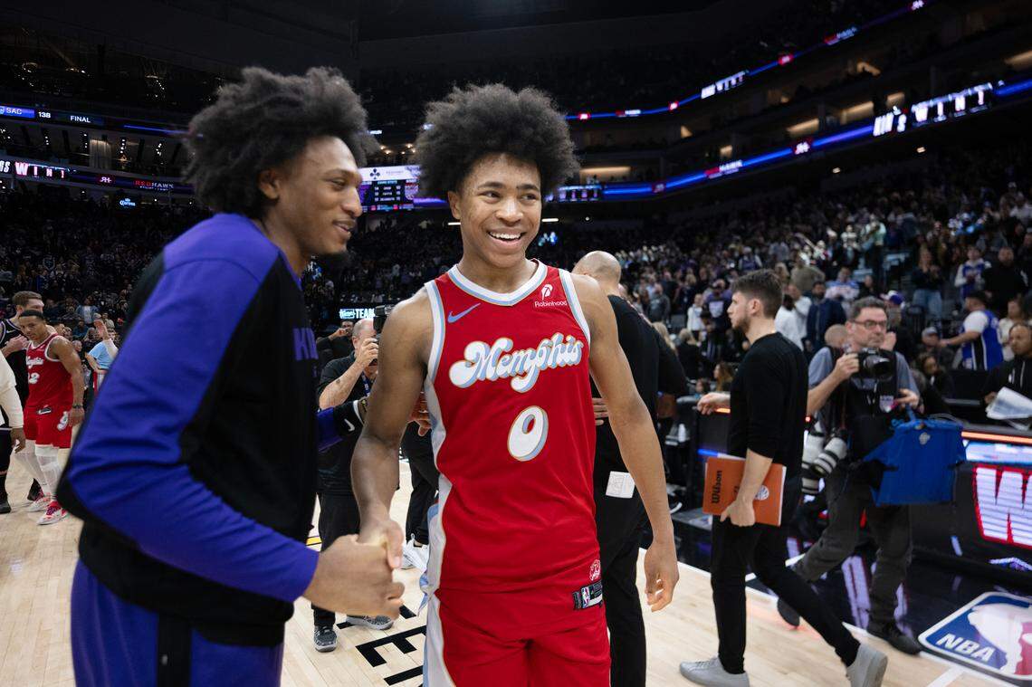 Memphis Grizzlies forward Jaylen Wells (0) is met by Sacramento Kings center Isaac Jones (17) following the Jan. 3 game at Golden 1 Center, his first stop in Sacramento as an NBA player.