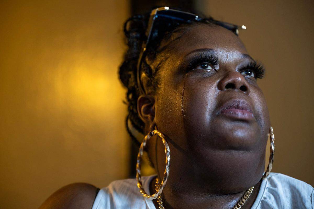 Sharaine Booker, the mother of Jonas Calhoun, cries as she reflects on the life of her son Aug. 9 in south Sacramento. Calhoun was shot and killed in a North Sacramento shooting earlier this month.