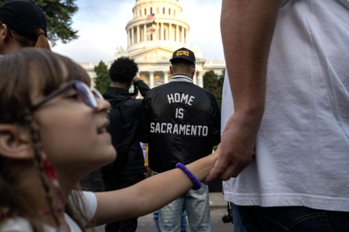 Zayn Silmi wears a "Home is Sacramento" jacket during a 175th birthday block party to celebrate California's anniversary of statehood on Tuesday, Sept. 9, 2025, at the state Capitol.